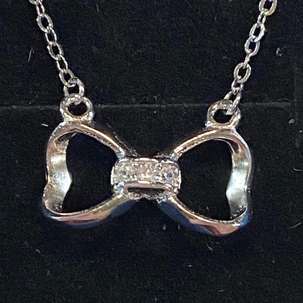 Silver Bow Necklace with Crystals on 18” Chain.